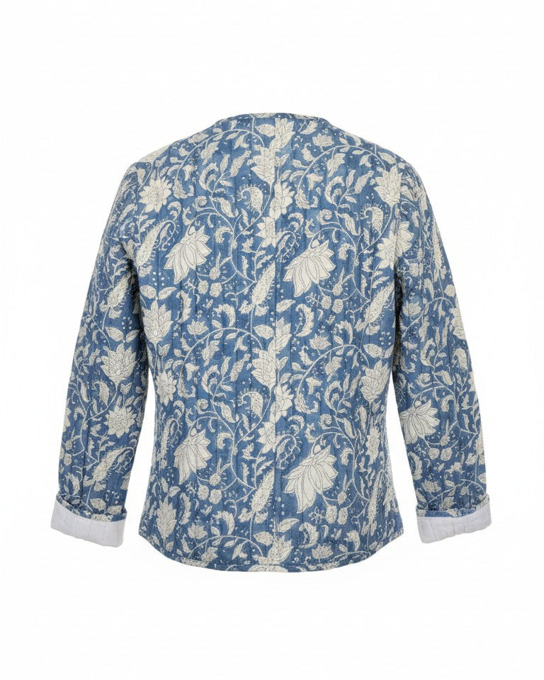 A women's long-sleeve jacket featuring a blue and white floral pattern. Quilted, lightweight  and has pockets