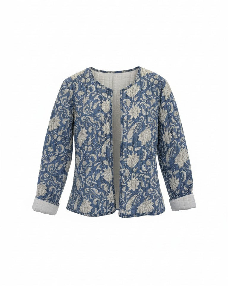 A women's long-sleeve jacket featuring a blue and white floral pattern. Quilted, lightweight  and has pockets