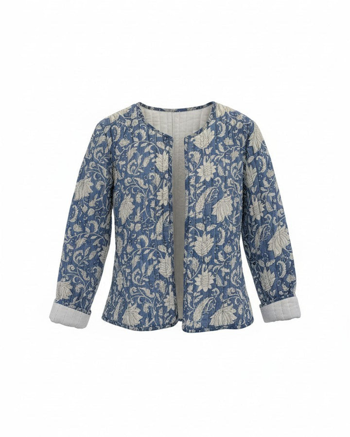 A women's long-sleeve jacket featuring a blue and white floral pattern. Quilted, lightweight  and has pockets