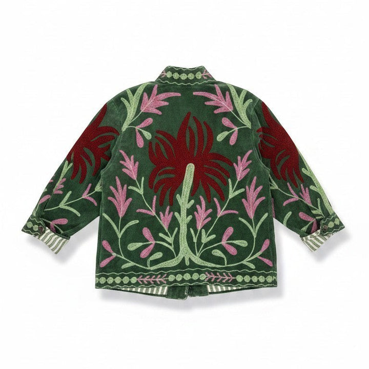 Indigo Haveli green cotton-blend jacket with intricate red and pink Suzani floral embroidery, featuring pockets and striped cuffs.