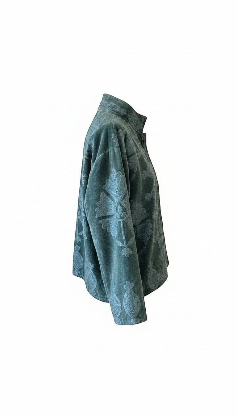 Indigo Haveli dark teal velvet jacket with tonal floral embroidery and a structured collar, side view.