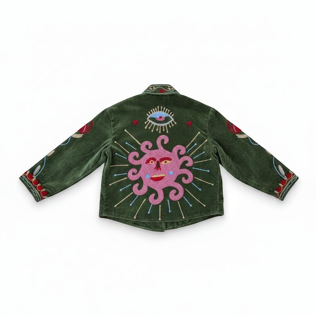 Indigo Haveli green velvet jacket with embroidered sun and eye motif, red and green Suzani pattern, cotton blend