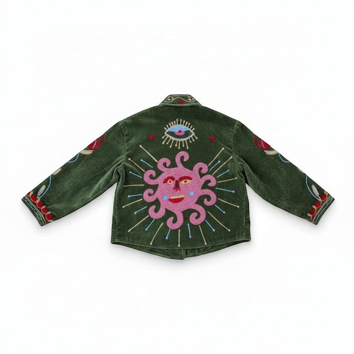 Indigo Haveli green velvet jacket with embroidered sun and eye motif, red and green Suzani pattern, cotton blend